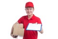 Handsome young worker in red t-shirt and cap smiling, holding a Royalty Free Stock Photo