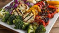 A handsomely presented plate featuring a rainbow of grilled vegetables including perfectly cooked broccoli florets Royalty Free Stock Photo