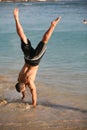 Handstand on the beach Royalty Free Stock Photo