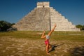 Handstand in front of famous Kukulkan pyramid in Chichen Itza, Mexico Royalty Free Stock Photo