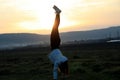 Handstanding on a field for fun