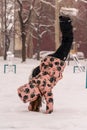 Playing and enjoying the snow. Handstands in the snow