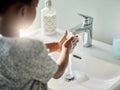 Handwashing is good, because germs are bad. Closeup shot of an unrecognisable boy washing his hands at a tap in a Royalty Free Stock Photo