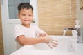 Handwashing, Little Asian kindergarten boy child washing hands in toilet , Hygiene Habits for Kids Royalty Free Stock Photo