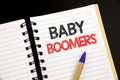 Handwriting Announcement text showing Baby Boomers. Business concept for Demographic Generation written on notepad with copy space Royalty Free Stock Photo