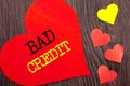 Handwriting Announcement text showing Bad Credit. Concept meaning Poor Bank Rating Score For Loan Finance written on Heart Love on