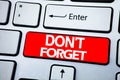 Handwriting Announcement text showing Do Not Forget. Business concept for Don t memory Remider written on red key on the keybord b Royalty Free Stock Photo