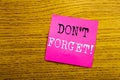 Handwriting Announcement text showing Do Not Forget. Business concept for Reminder Message written on sticky note empty paper, woo Royalty Free Stock Photo