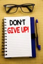 Handwriting Announcement text showing Don t Give Up. Business concept for Motivation Determination, Written on tablet laptop, wood