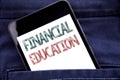 Handwriting Announcement text showing Financial Education. Business concept for Finance Knowledge Written phone mobile phone, cell