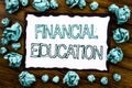 Handwriting Announcement text showing Financial Education. Business concept for Finance Knowledge Written on sticky note paper, wo