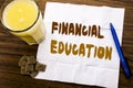 Handwriting Announcement text showing Financial Education. Business concept for Finance Knowledge written on tissue paper on the w