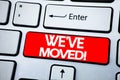 Handwriting Announcement text showing We Have Moved. Business concept for Company Changing Place written on red key on the keybord