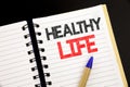 Handwriting Announcement text showing Healthy Life. Business concept for Good Health Food written on notepad with copy space on ol Royalty Free Stock Photo