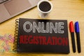 Handwriting Announcement text showing Online Registration. Business concept for Internet Login written on notebook book on the woo