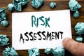 Handwriting Announcement text showing Risk Assessment. Business concept for Safety Danger Analyze Written on sticky note paper, wo Royalty Free Stock Photo