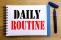 Handwriting Announcement text showing Daily Routine. Business concept for Habitual Lifestyle Written on notepad note paper backgro