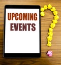 Handwriting Announcement text showing Upcoming Events. Business concept for Appointment Agenda List Written on tablet with wooden Royalty Free Stock Photo