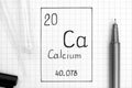 Handwriting chemical element Calcium Ca with black pen, test tube and pipette Royalty Free Stock Photo