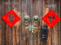 The Handwriting Chinese blessing Fu on the wooden door with traditional chinese bronze handle