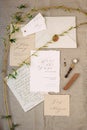 Handwriting letter, love message. Wedding vows, calligraphy cards and spring twigs, flat lay. Valentine`s day inspiration