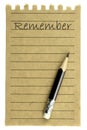 Handwriting Remember on a natural note paper and pencil Royalty Free Stock Photo