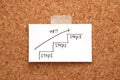 Handwriting stairs heading upwards with arrow on paper on cork board. Royalty Free Stock Photo