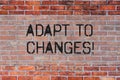 Handwriting text Adapt To Changes. Concept meaning Innovative changes adaption with technological evolution Brick Wall