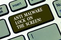 Handwriting text Anti Malware Lock On The Screen. Concept meaning Security safety against malware hacking Keyboard key