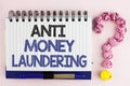 Handwriting text Anti Monay Laundring. Concept meaning entering projects to get away dirty money and clean it written on Notebook Royalty Free Stock Photo