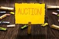 Handwriting text Auction. Concept meaning Public sale Goods or Property sold to highest bidder Purchase Clothespin