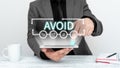 Handwriting text Avoid. Business approach Contrive not to meet someone Stop oneself from doing something Royalty Free Stock Photo