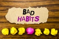 Handwriting text Bad Habits. Concept for Improvement Break Habitual Hebit Written on sticky note paper reminder, wooden backgrou