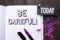 Handwriting text Be Careful. Concept meaning Caution Warning Attention Notice Care Beware Safety Security written on Notebook Book Royalty Free Stock Photo