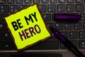 Handwriting text Be My Hero. Concept meaning Request by someone to get some efforts of heroic actions for him Yellow paper keyboar