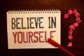 Handwriting text Believe In Yourself. Concept meaning Determination Positivity Courage Trust Faith Belief Reddish paper balls stru