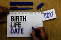 Handwriting text Birth Life Date. Concept meaning Day a baby is going to be born Maternity Pregnancy Give life Man holding marker