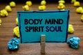 Handwriting text Body Mind Spirit Soul. Concept meaning Personal Balance Therapy Conciousness state of mind Blurry wooden deck yel Royalty Free Stock Photo