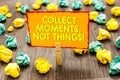 Handwriting text Collect Moments, Not Things. Concept meaning Happiness philosophy enjoy simple life facts Paperclip hold written Royalty Free Stock Photo