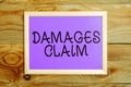 Handwriting text Damages Claim. Word for Demand Compensation Litigate Insurance File Suit Royalty Free Stock Photo