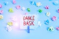 Handwriting text Dance Basic. Concept meaning activity that utilizes the body and the range of movement Colored crumpled papers