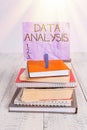 Handwriting text Data Analysis. Concept meaning Translate numbers to Analytical Conclusion Forecasting pile stacked books notebook