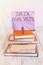 Handwriting text Data Analysts. Concept meaning Programmer Design and Create Report Identifies patterns pile stacked books