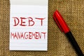 Handwriting text Debt Management. Concept meaning The formal agreement between a debtor and a creditor