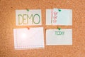 Handwriting text Demo. Concept meaning Demonstration of a product techniques and capabilities Public meeting Corkboard color size Royalty Free Stock Photo