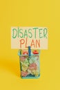 Handwriting text Disaster Plan. Concept meaning Respond to Emergency Preparedness Survival and First Aid Kit Trash bin Royalty Free Stock Photo