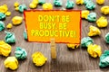 Handwriting text Don t not Be Busy. Be Productive. Concept meaning Work efficiently Organize your schedule time Paperclip hold wri Royalty Free Stock Photo