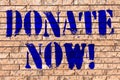 Handwriting text Donate Now. Concept meaning Give something to charity Be an organ donor Help others Brick Wall art like