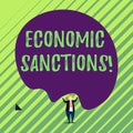 Handwriting text Economic Sanctions. Concept meaning Penalty Punishment levied on another country Trade war Male human