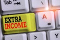Handwriting text Extra Income. Concept meaning Additional fund received or earned from a non regular basis White pc Royalty Free Stock Photo